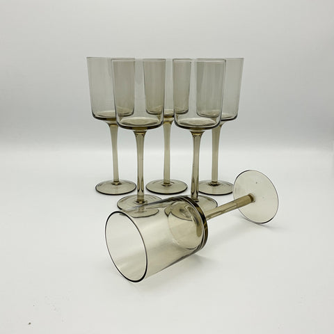 tall stemmed glasses in smokey glass
