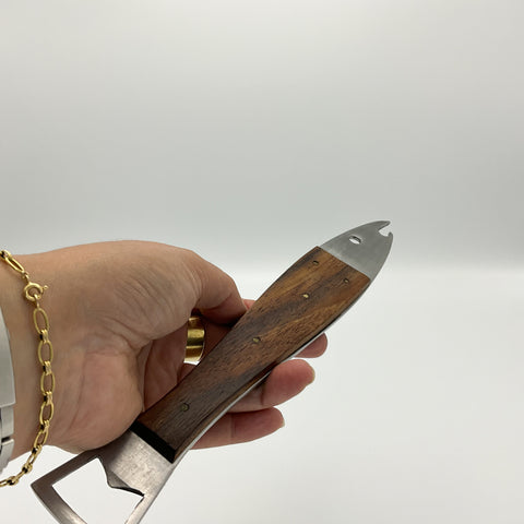 Rare bottle opener by Carl Aubock in the shape of a fish. Model Neptune 4687 in stainless steel and teak wood