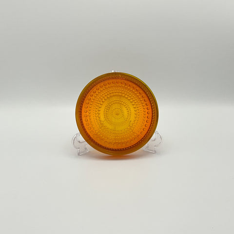 Sixties vintage small dish designed by Finnish glass artist Oiva Toikka for Nuutajarvi or Arabia. Warm orange amber brown colour.