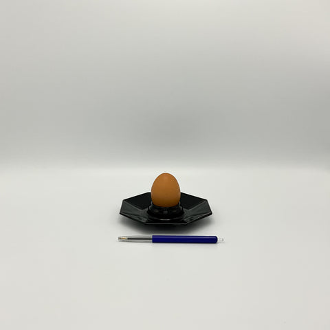 Vintage octime egg cup with egg and pen for size reference